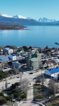 Grey Glacial At Torres Del Paine Punta Arenas Chile. Aerial View Of Massive Glacier Calves Into A Lagoon Of Icy Water. Snowflakes Lake Patagonia Landscape Exploring. Snowflakes Forest Trees.
