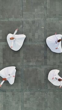 Whirling Dervishes Performing Sema Ceremony &ndash; Aerial Drone Shot of 4 Mevlevi Spinning in Traditional Sufi Ritual (4K)