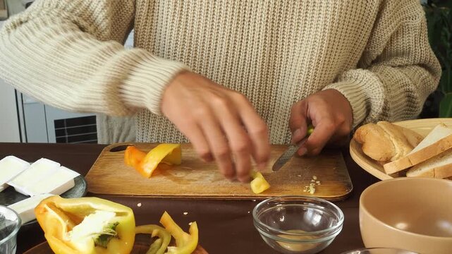 a man making egg sandwiches for breakfast