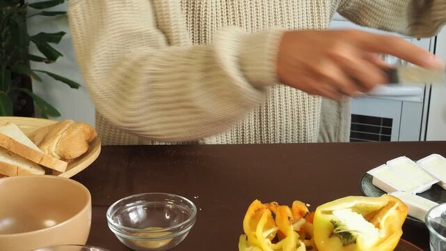 a man making egg sandwiches for breakfast
