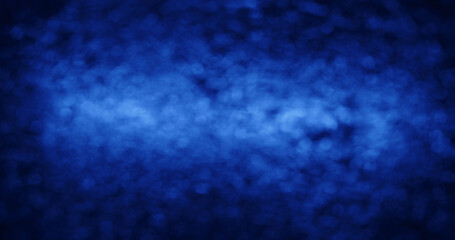 Fototapeta premium A vibrant blue abstract bokeh background with a soft, dreamy texture suitable for creative design use.
