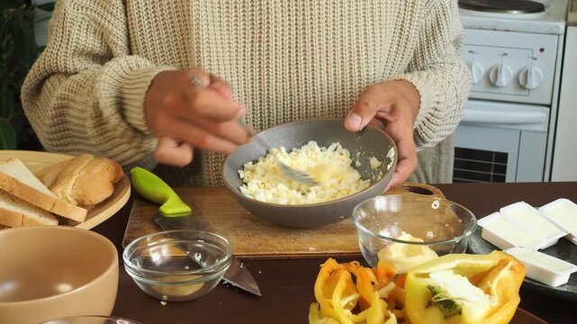 a man making egg sandwiches for breakfast
