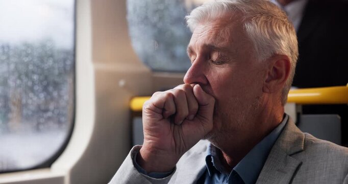 Travel, yawning and mature businessman on bus in winter with commute fatigue, crisis or rain risk stress. Metro, public transport and tired person on train with mental health, anxiety or burnout