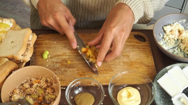 a man making egg sandwiches for breakfast