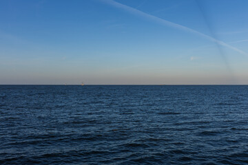 Obraz premium Traditional wooden lighthouse in Volendam at sunset, Netherlands.