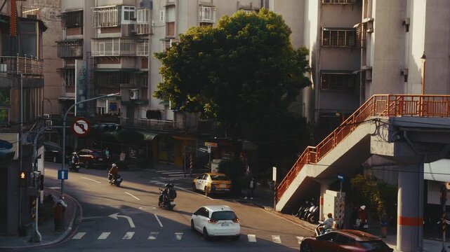 Urban traffic flow sunlight and tree shadows, city lifestyle.