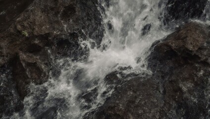 Dynamic Water Flowing Over Rocks in a Natural Stream.