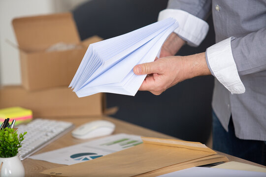 close-up of a man with enveloppes