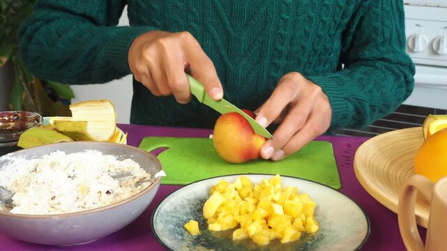 a man preparing a fruit dessert