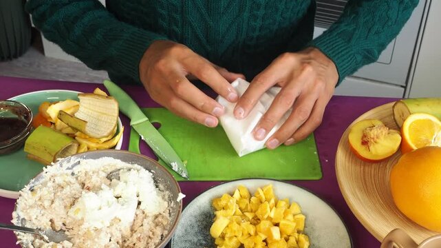 a man preparing a fruit dessert