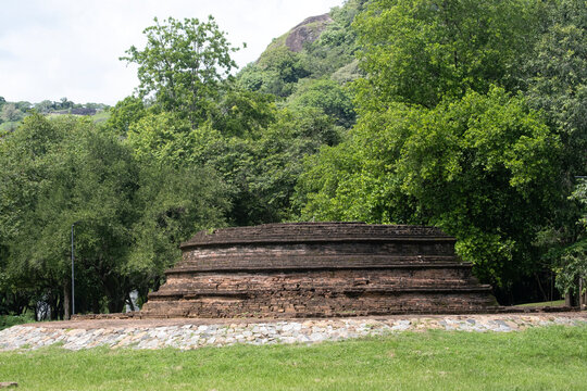 An old ruined Buddhist stupa in the background of the jungle in Sri Lanka. A little-known historical site.
