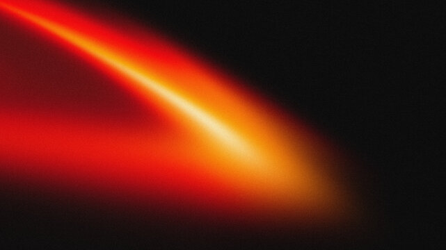 Abstract red and orange light leak with film grain texture on black background