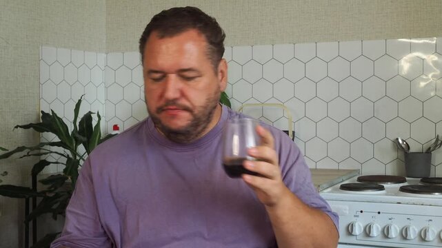 a grown man is having lunch in the kitchen