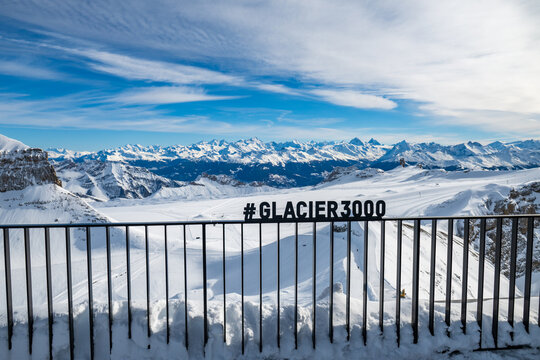 Winter photo of Glacier 3000 in Switzerland, showcasing snow-covered peaks, icy glaciers, and dramatic alpine scenery under a clear mountain sky