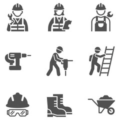 Obraz premium Construction workers with tools and safety gear at work sites