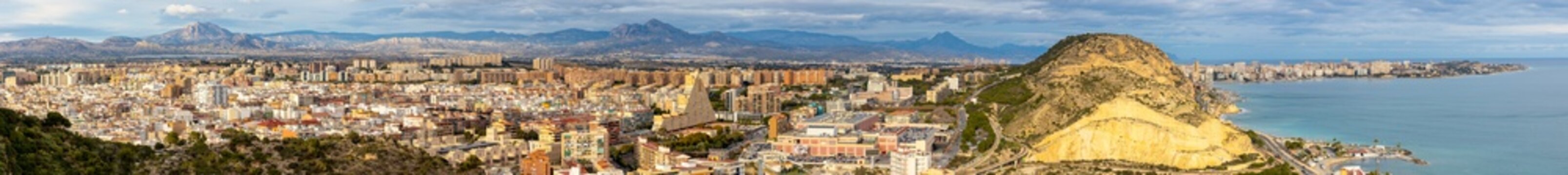 Ultra-high resolution panoramic view of metropolitan Alicante cityscape with central and northern urban districts, Serra Grossa hill and Mediterranean Sea bay of Valentia region of Spain