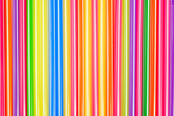 Obraz premium Colorful straws arranged in vertical lines on a flat surface for a fun drink experience
