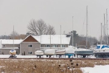 Snow-Covered Marina with Boats in Winter