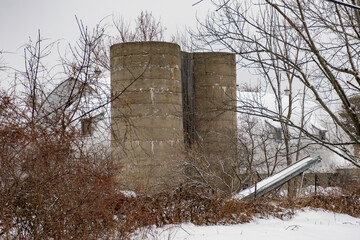 Old Grain Silos in Snowy Rural Setting