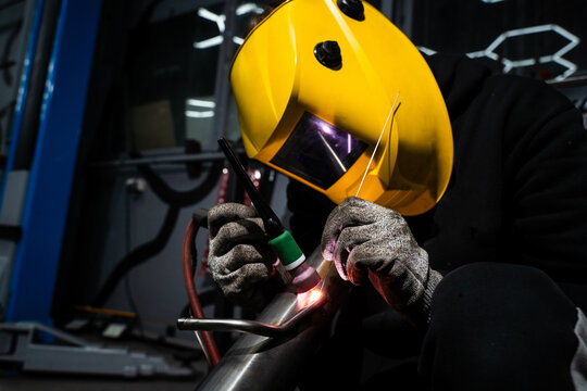 Custom exhaust system TIG welded using argon and tungsten electrode