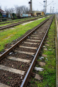 rusty railway tracks stretching into the distance
