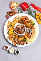 Grilled Chicken Sharing Platter with Veggies, Sesame Mushrooms and Sauces Top View