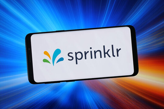 Stuttgart, Germany - 02-05-2026: In this photo illustration, the logo of US CXM software company Sprinklr Inc. is displayed on a smartphone in front of abstract background on computer screen.