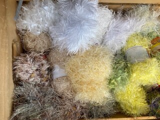 balls of eyelash yarn in various colors