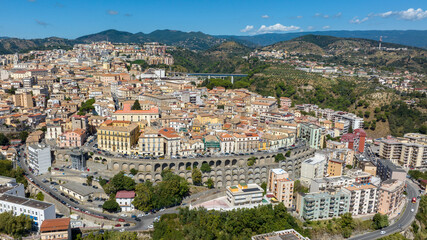 Obraz premium Aerial view of the historic center of Catanzaro, located in southern Italy. It is the regional capital of Calabria and is perched on the hills. It is a sunny summer morning.