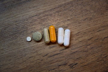 Assorted supplements in ceramic dishes, a modern tableau of health