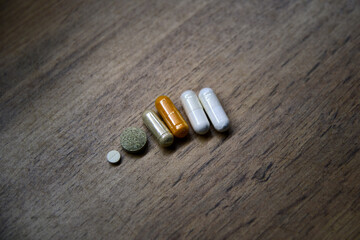Assorted supplements in ceramic dishes, a modern tableau of health