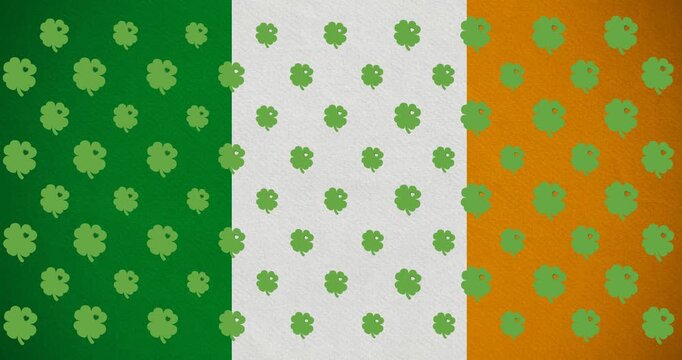 Digital animation of multiple clover leaves moving against irish flag