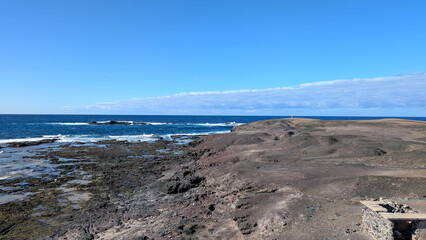 Rocky coast with blue waters of the Atlantic Ocean, Fuerteventura, Canary Islands, Spain.  © Inha