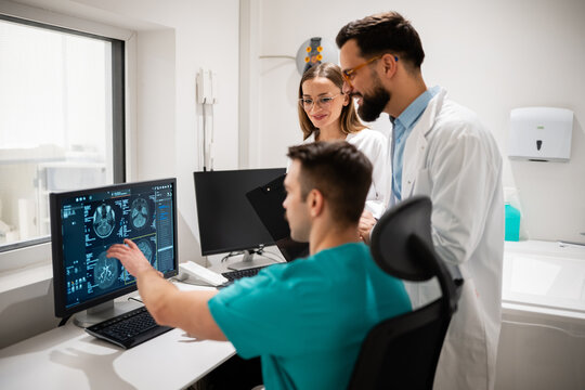 Medical team analyzing brain mri scan results