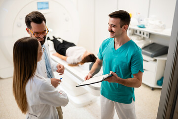Medical team collaborating during mri scan procedure