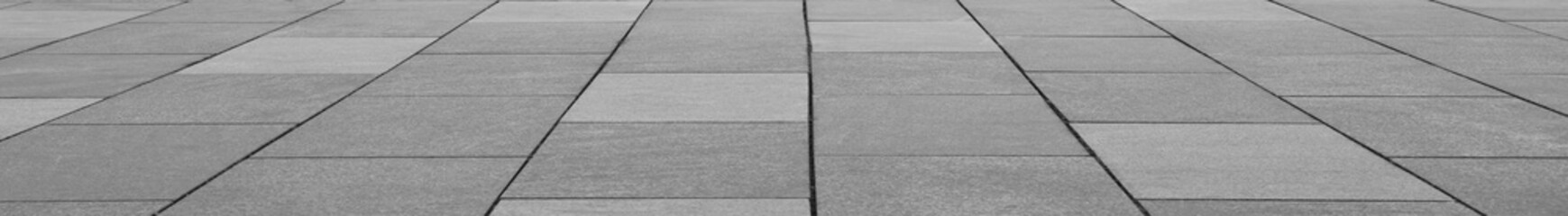 Naklejka premium brick walkway with a green bush on the side Decorative shrubs and green ornamental plant beside with stone pavement floor, perspective side view with empty copy space