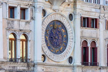 Obraz premium Ancient astronomical clock on St. Mark's square in center of Venice, Italy