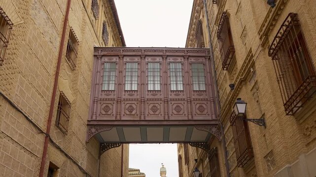 Medieval passageway between ancient buildings of the Unesco city of Toledo, Spain.