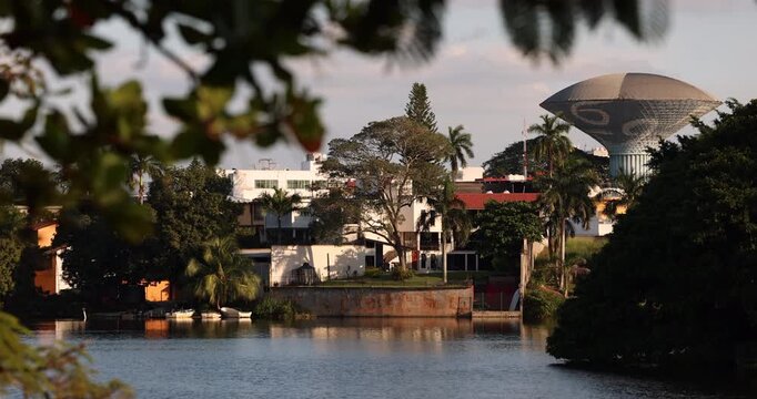 Villahermosa, Tabasco, Mexico - January 2, 2026: Late afternoon sun shines on the lakeside skyline and water tower.