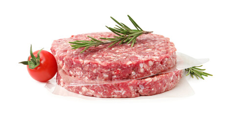 Naklejka premium Uncooked meat patties with rosemary and tomato isolated on white