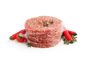 Fotobehang Onderzeeër Uncooked meat patties with thyme, chili peppers and tomato isolated on white  © New Africa