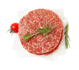 Naklejka premium Uncooked meat patties with rosemary and tomato isolated on white, top view
