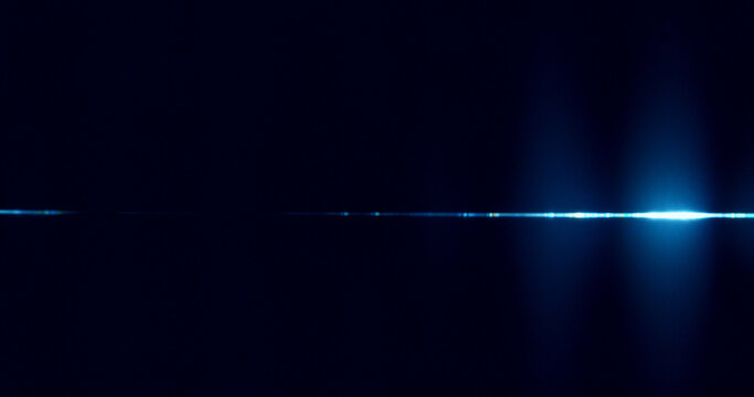 Abstract cinematic lens flare with bright light burst and star rays, isolated on black background. Optical light effect ideal for VFX overlays, transitions, titles and dramatic visual accents.