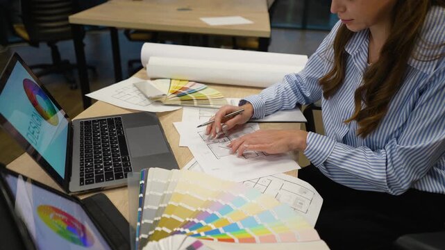 Professional interior designer working on a blueprint