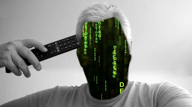 Man whose face is replaced by detoxing text holding a remote control pointed at their head like a gun