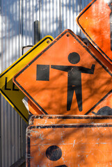Orange Road Construction Signs with Flagman Caution