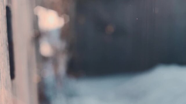 High-speed 180 fps slow motion of shimmering diamond dust snowfall with vintage hexagonal bokeh - Cinematic nature background featuring magical winter light and soft-focus snow crystals