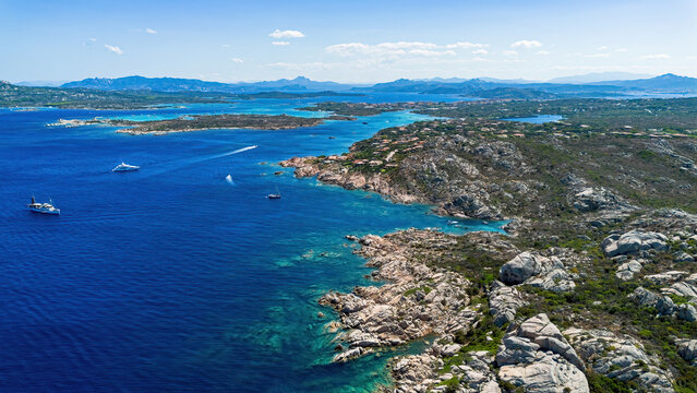 Aerial view of the rugged granite coastline and turquoise sea of Maddalena island in Sardinia, Italy