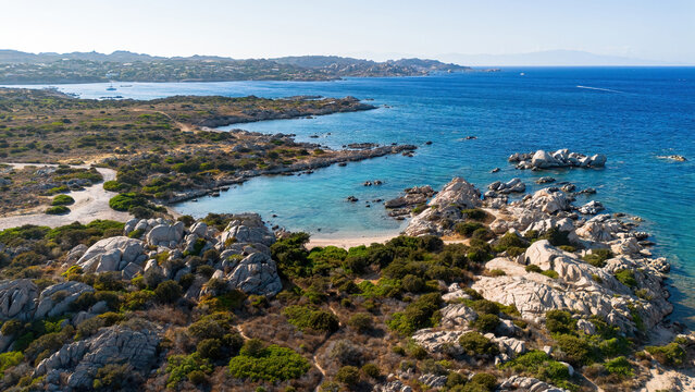 Aerial view of Capocchia d'u purpu beach (Testa del Polpo) and its iconic granite rock on Giardinelli island in La Maddalena archipelago, Sardinia, Italy