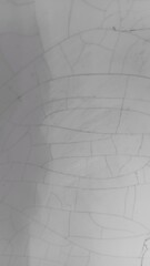 Obraz premium Detailed closeup of cracked white surface with broken pattern